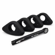 Product shot of four round JetBlack Freedom Rocker Feet with the pump on a white background, no packaging visible.