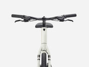 White electric bike with black handlebars on a white background