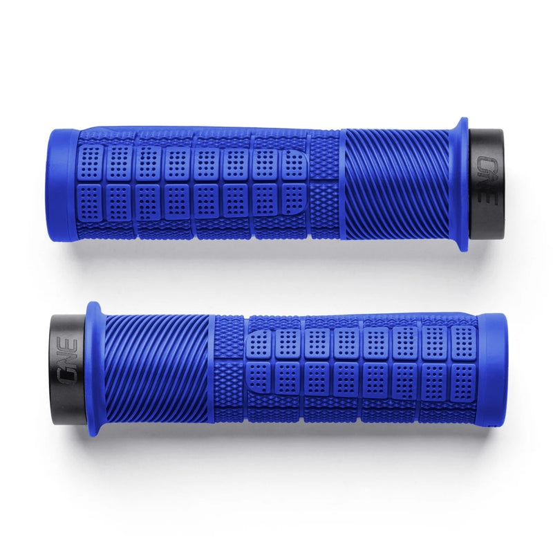 Two blue motorcycle grips with black ends on a white background