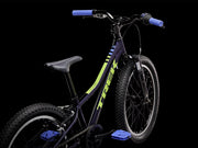 Children's bicycle with blue handlebars and seat on a black background