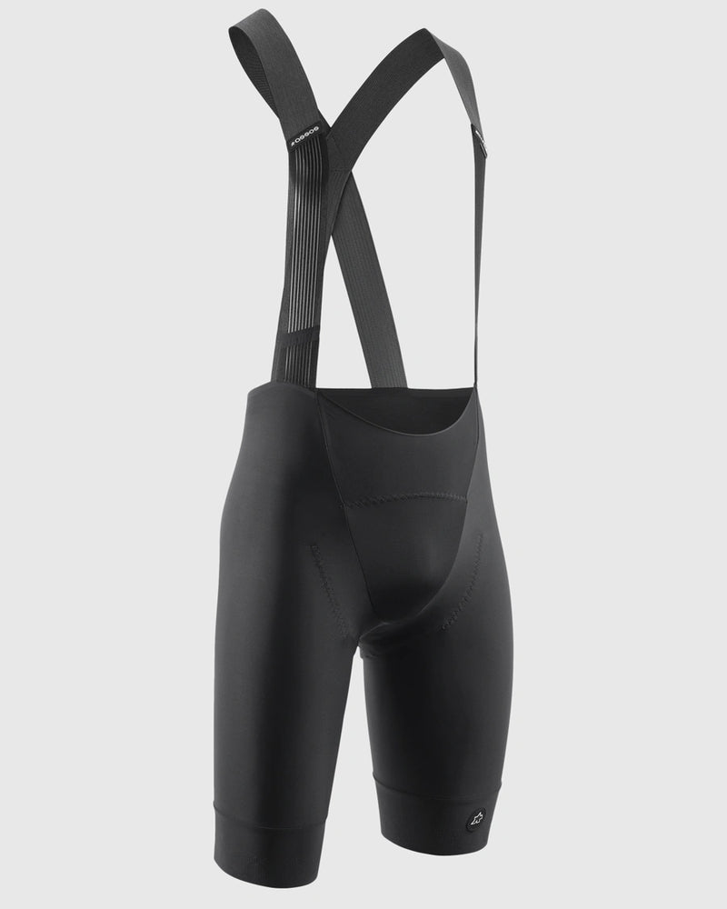 Black cycling bib shorts on a light gray background