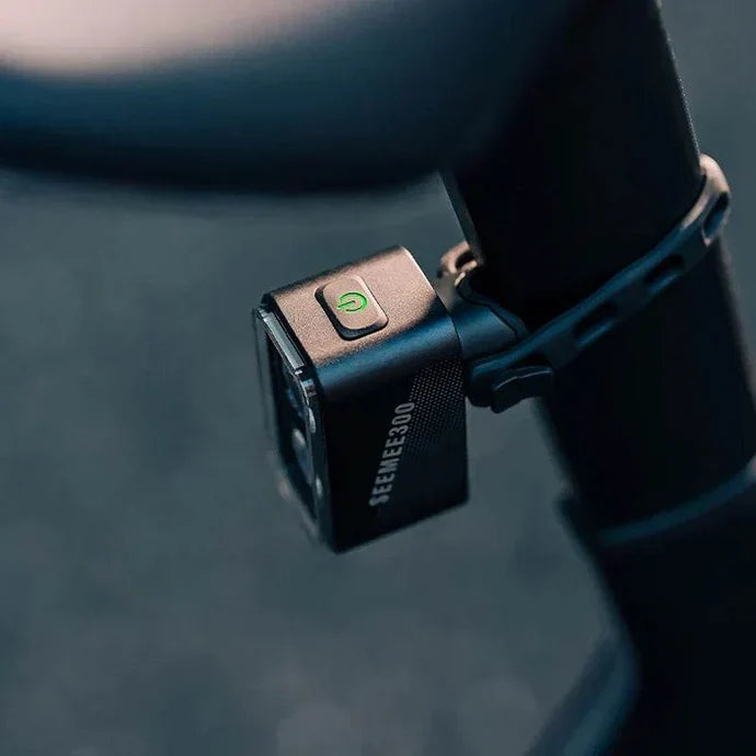 Lifestyle image of the Magicshine Seemee 300 taillight attached to the back of a bicycle seatpost beneath the saddle
