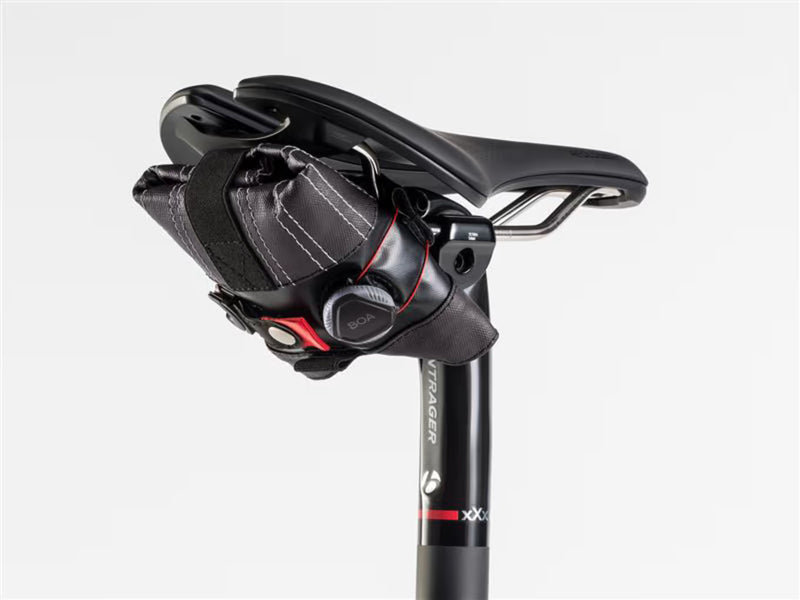 Spring Roll seat bag rolled up and mounted under the saddle using the BOA Closure System.