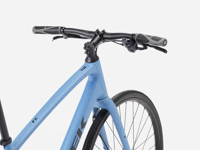 Blue hybrid fitness bicycle with black handlebars on a white background