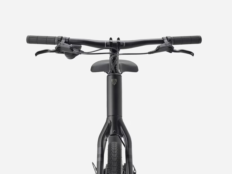 Front view of a black stepover cruiser electric bicycle showing the handlebars, saddle, and frame against a light gray background.