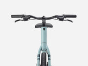 Light blue bicycle with black handlebars on a white background