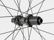 Close-up of a bicycle hub with spokes on a white background