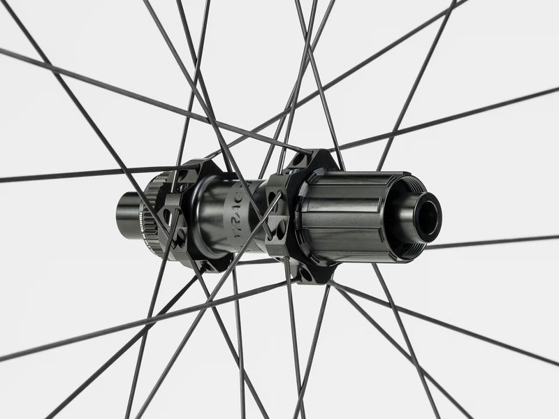 Close-up of a bicycle hub with spokes on a white background