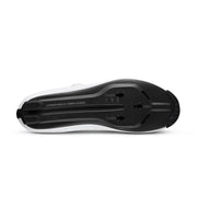 Black toy car made of building blocks with measurements on a white background