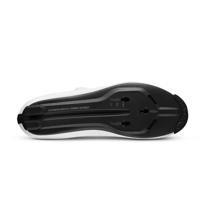 Black toy car made of building blocks with measurements on a white background