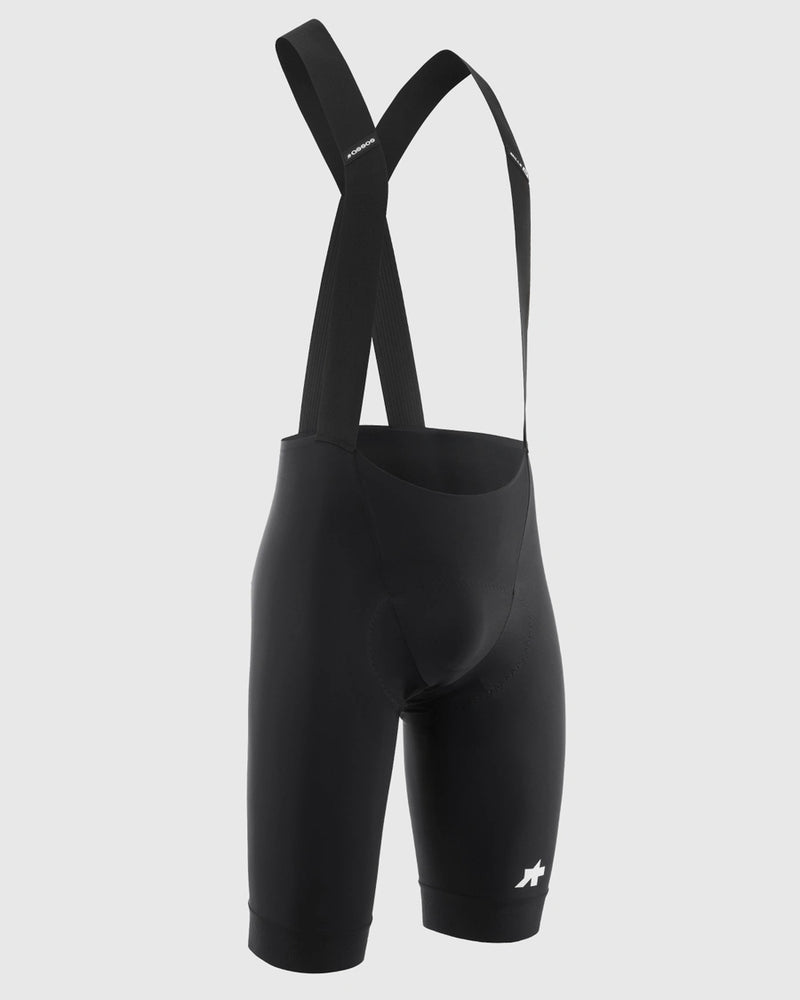 Black cycling bib shorts on a light gray background