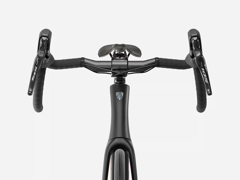 Front view of a black drop-bar road bicycle handlebar setup with Shimano route bar levers and a black saddle, shown on a light gray background.