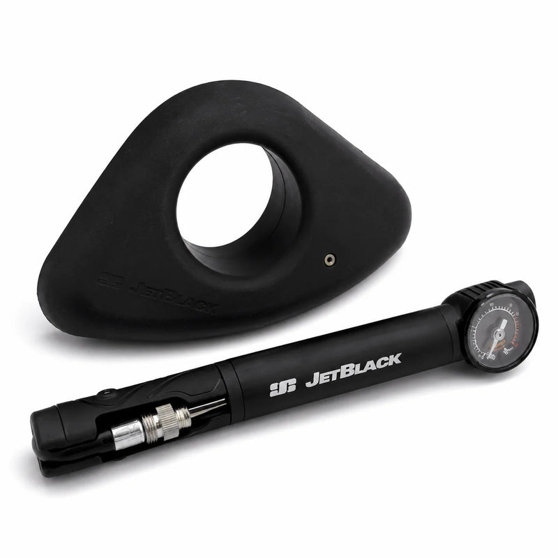 Product shot of one JetBlack Freedom Rocker Foot with the pump placed in front on a white background.