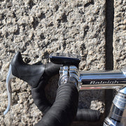 side view of cateye computer mounted on a road bike handlebar