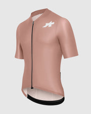 Pink cycling jersey with a logo on a light gray background
