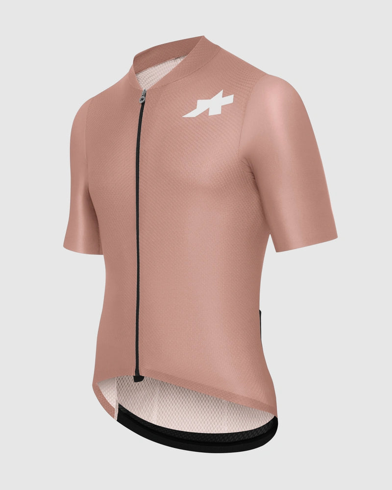 Pink cycling jersey with a logo on a light gray background