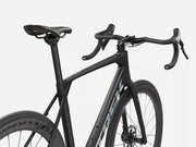 Dark endurance road bicycle with black components on a white background