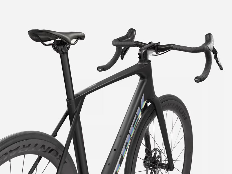 Dark endurance road bicycle with black components on a white background