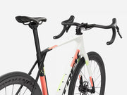 White endurance road bicycle with black and orange accents on a white background