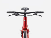 Red hybrid fitness bicycle on a white background