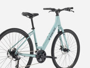Light blue bicycle with black components on a white background