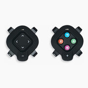 Wahoo KICKR CORE 2 with Zwift Cog and Click smart trainer accessories showing the two Zwift Click controllers on a white background, including black and coloured buttons
