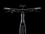Black electric bike handlebar and front section on a black background