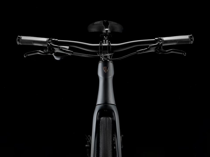 Black electric bike handlebar and front section on a black background