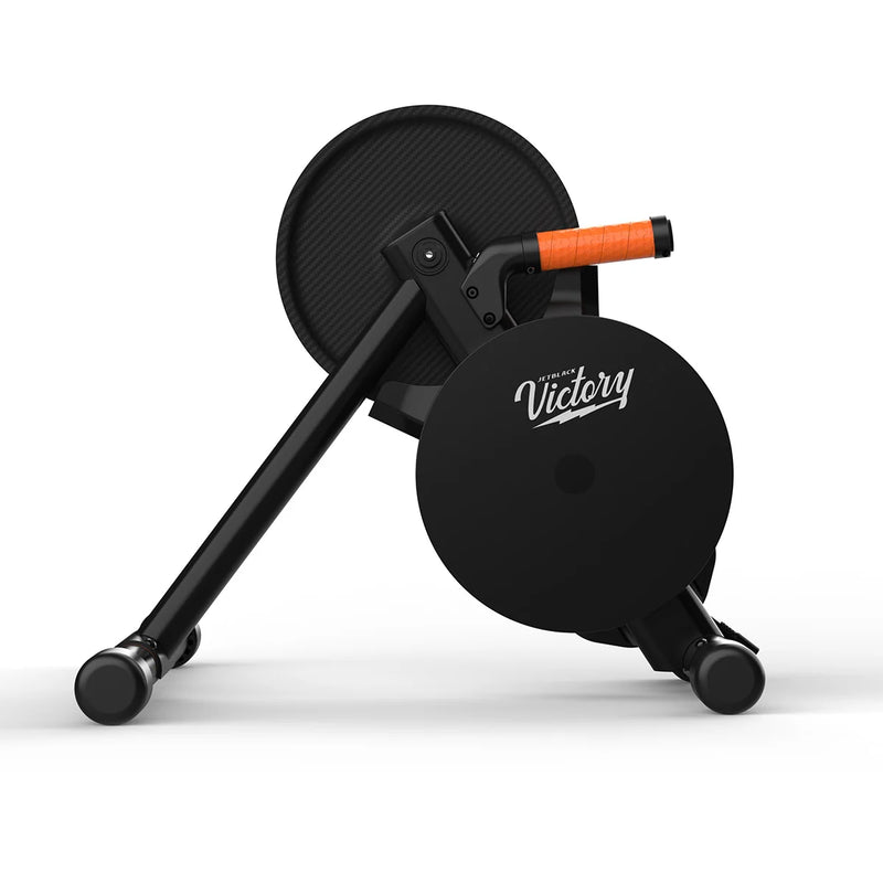 Side product shot showing flywheel, orange accents and JetBlack branding