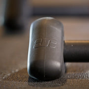 Closeup lifestyle shot showing JetBlack Freedom Rocker Feet attached to the trainer’s feet, positioned on a training mat.
