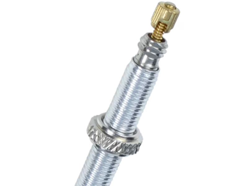 Tire pressure gauge with brass valve stem on a white background