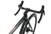 Close-up of a black bicycle frame and handlebars on a white background