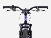 Close-up of a bicycle handlebar and front wheel on a white background