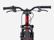 Close-up of a bicycle handlebar and front wheel on a white background