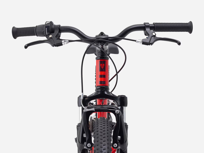 Close-up of a bicycle handlebar and front wheel on a white background