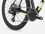 Close-up of a endurance road bicycle wheel with chain and gear on a white background