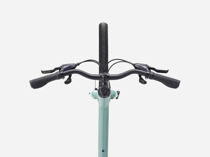 Bicycle handlebar with black grips and controls on a light blue frame against a white background