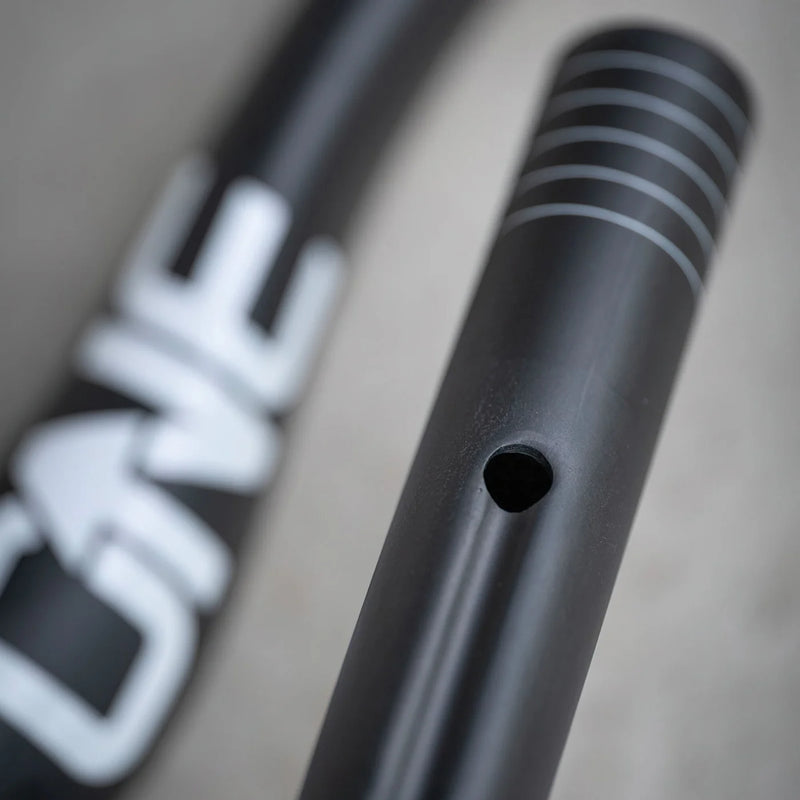 Close-up of a black bicycle frame with 'Cane' branding.