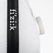 Close-up of a white cycling jersey with 'fi'zi:k' branding on a black stripe.