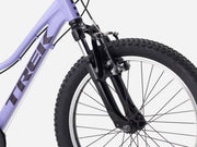 Close-up of a Trek bicycle's front wheel and suspension fork on a white background