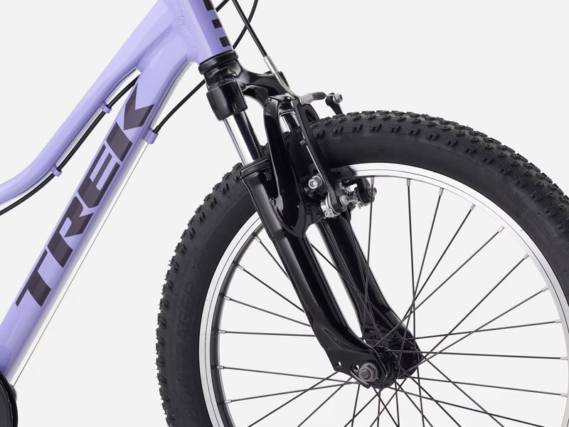 Close-up of a Trek bicycle's front wheel and suspension fork on a white background