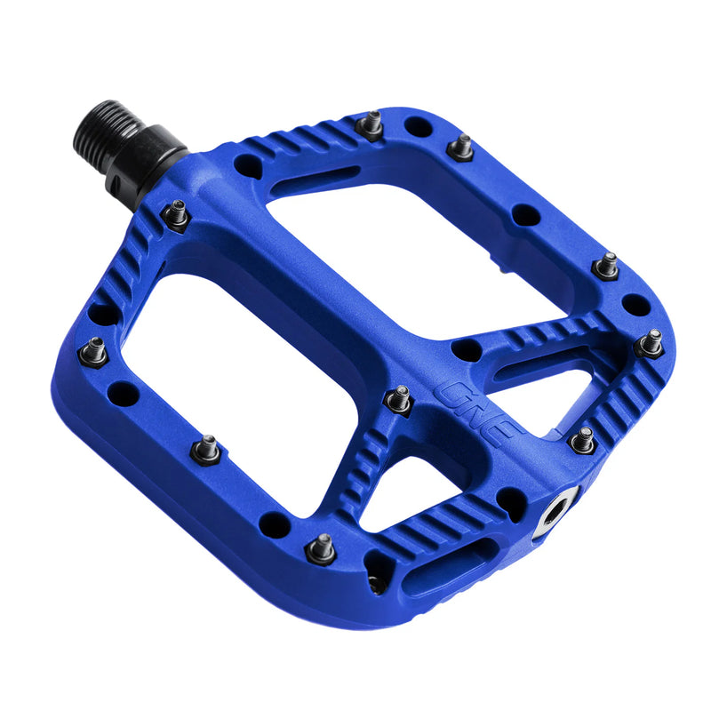 Blue bicycle pedal with metallic finish on a white background