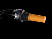 Close-up of a motorcycle handlebar with an orange grip and black throttle on a black background