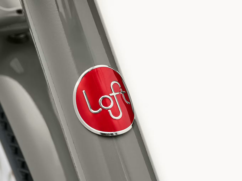 Close up of head frame of bicycle  with Loft branding logo  visible (Electra Loft Go! 7D EQ Step-Over)