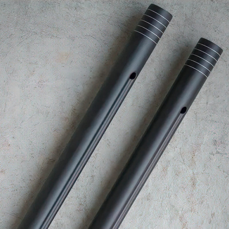 Two metallic cylindrical objects on a textured surface