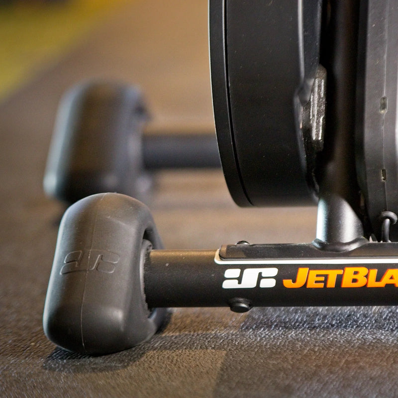 Lifestyle image showing two JetBlack Freedom Rocker Feet under the trainer, with the front foot in focus and the rear foot slightly blurred.