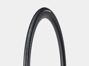 Black bicycle tire with a brand logo on a light gray background