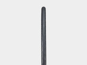 Black bicycle tire on a light gray background