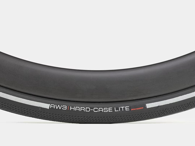 Close-up of a bicycle tire with 'AW3 Hard-Case Lite' branding on a white background