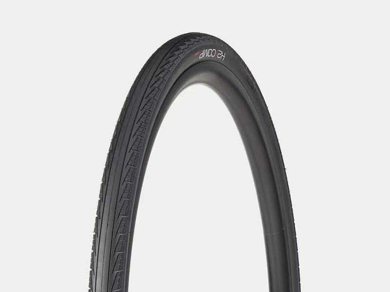 Black bicycle tire on a light gray background
